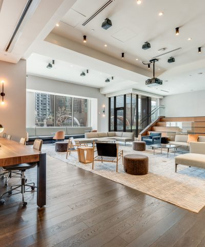 Open event floor at Echelon Innovation Center with lounge groupings and stairs to the mezzanine