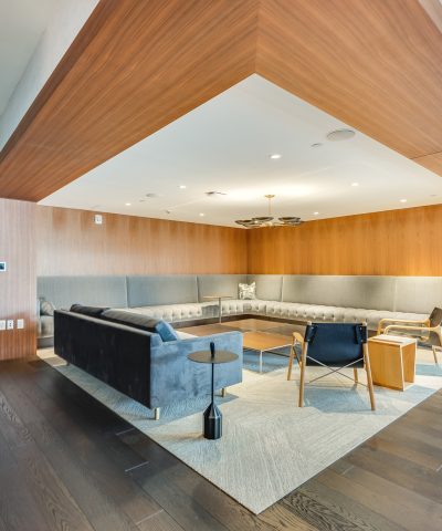 Wood-panelled private room with built-in banquette seating at Echelon Innovation Center